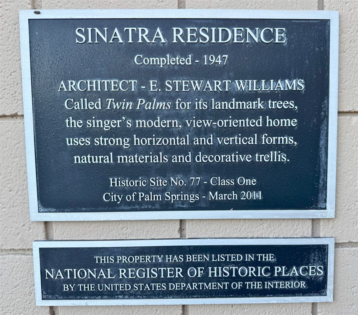 Bronze plaques marking the Sinatra Residence as Palm Springs Historic Site No. 77 and a National Register property